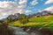 Beautiful alpine landscape of Italian dolomiti with river and green meadow. Cortina dAmpezzo town, Veneto, Italy