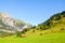 Beautiful Alpine landscape near Kandersteg in Switzerland captured in summer season. Green meadows, rocky hills. Swiss Alps, rocks