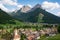 Beautiful alpine landscape. Village Pozza di Fassa at the foot of Dolomites
