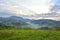 The Beautiful alpine meadow with green grass. sunrise. landscape on wild transylvania hills. Holbav. Romania. Low key, dark backgr