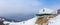 Beautiful alpine restaurant and museum on mountain against sky during winter