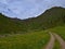 Beautiful alpine valley with blooming meadows, wooden hut and waterfall near AuÃŸervillgraten, Austria