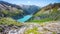 Beautiful alpine walley with azure blue water dam