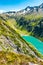 Beautiful alpine walley with azure blue water dam