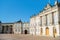 beautiful Amalienborg Square with historical buildings and columns at sunny day,
