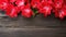 Beautiful Amaryllis flowers on wooden background, top view