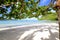 Beautiful amazing incredible tropical beach, white sand, blue sky with clouds and reflection of trees on the sand