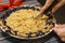 Beautiful American style blueberry pie, human hands cutting in it with knife