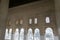 Beautiful ancient islamic architecture style inside of alhambra antique palace with arc windows and relief