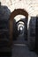 Beautiful ancient old stone arch corridor in the ruins of Pergamon city in Turkey