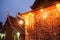 Beautiful ancient temple at twilight. Warm light of old lantern, blue ultramarine night sky background. Wat Xieng Thong, Luang Pr