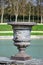 Beautiful Antique Bronze Vases in Gardens of Versailles palace, Paris