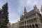 Beautiful and antique Brussels museum building with christmast tree in sunny blue sky sunset