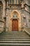 Beautiful antique door to the Catholic Cathedral. Entrance to the church. Exterior of a religious building.