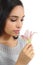 Beautiful arab woman smelling a flower