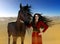 Beautiful Arabian Princess and her Horse in the Desert