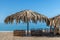 Beautiful arbor from palm leaves on the beach in Abkhazia