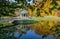 Beautiful arbor on a pond, sunny autumn afternoon