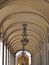 Beautiful arcades in Lisbon with traditional lamps