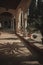 Beautiful arch with lanterns and potted plants in church. Palm tree silhouette