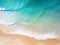 Beautiful ariel shot of a tropical beach with waves breaking on sand