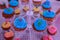 Beautiful arrangements of colorful cup cakes on baptism day