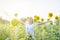 Beautiful Asia woman enjoy flowers in garden outdoor at countryside of Thailand