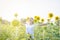 Beautiful Asia woman enjoy flowers in garden outdoor at countryside of Thailand