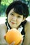 Beautiful Asia woman sport holding orange fruits for healthy food concept