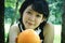 Beautiful Asia woman sport holding orange fruits for healthy food concept