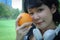 Beautiful Asia woman sport holding orange fruits for healthy food concept