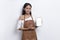 Beautiful Asian Barista waitress demonstrating mobile cell phone on white background