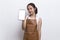 Beautiful Asian Barista waitress demonstrating mobile cell phone on white background