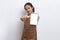 Beautiful Asian Barista waitress demonstrating mobile cell phone on white background