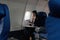Beautiful Asian businesswoman working with tablet in aeroplane. working, travel, business concept