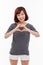 Beautiful Asian casual woman show heart shape.