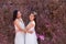 Beautiful Asian couple with with lace wedding LGBT women spent time together in park  Attractive 2 women hold hand in hand hug