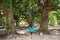 Beautiful asian girl going inside tropical forest