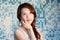 Beautiful Asian lady in front of mosaic and think