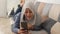 Beautiful Asian muslim lady doing selfie portrait on phone or doing video call while sitting on sofa, happy smiling cheerful