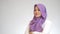 Beautiful Asian muslim woman wearing white shirt and purple hijab smiling friendly with arms crossed, confident successful woman s