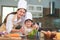 Beautiful Asian woman and cute little boy with eyeglasses prepare to cooking in kitchen at home. People lifestyles and Family.