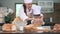 Beautiful Asian woman and cute little boy with eyeglasses prepare to cooking in kitchen at home together. Lifestyles and Family. H