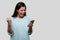 Beautiful asian woman excited and happy, celebrating winning achievement with cellphone in hand, good news, for advertisement with