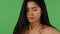 Beautiful Asian woman feeling sick and coughing on green chromakey