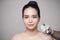 Beautiful asian woman gets beauty facial injections. Face aging