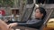 Beautiful Asian woman relaxing in the beach sitting on a wooden clair.