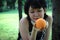 Beautiful Asian woman sport holding orange fruits for healthy food concept