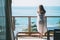 A beautiful asian woman standing and enjoy watching the sea view