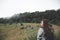 A beautiful Asian woman tourist walking and trekking along the mountains in tropical forest